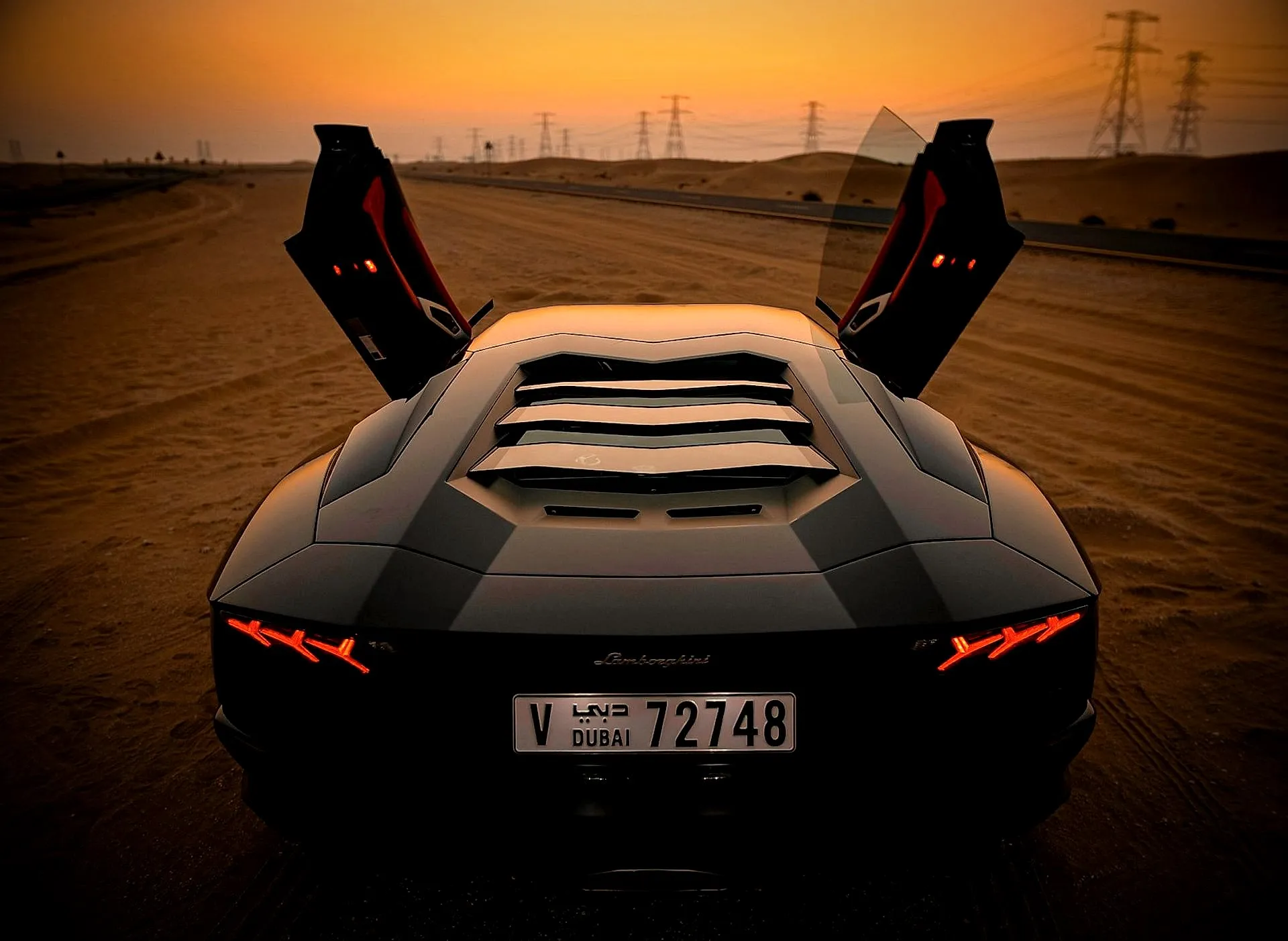 Luxury car with Dubai plates at dusk